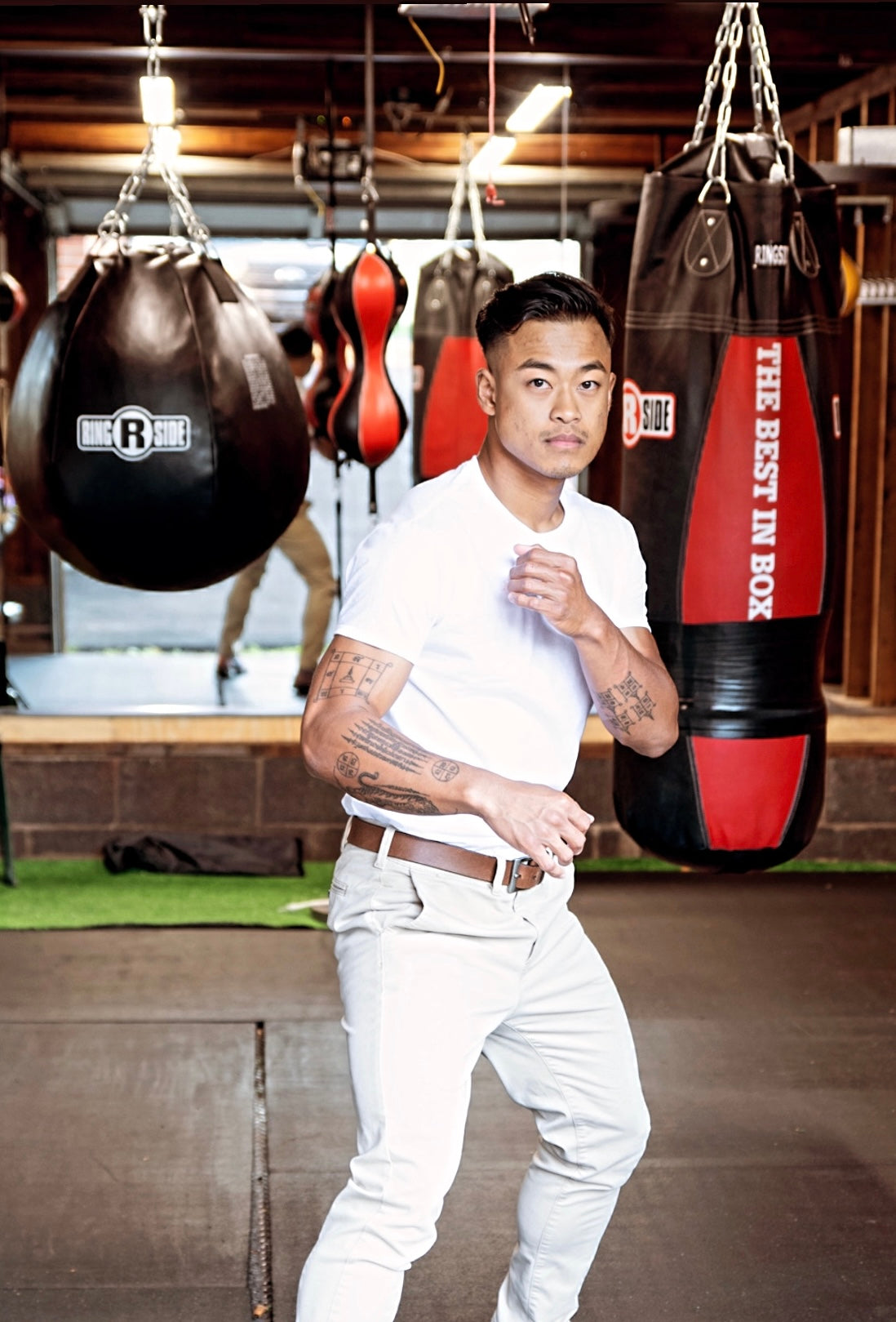 Portrait of boxing coach Rada Rann in a boxing gym.
